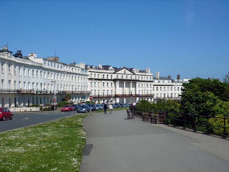 A curving white terrace overlooking a green